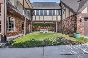 Exterior space featuring a balcony, a patio, and ceiling fan