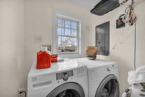 Clothes washing area with electric panel and washing machine and clothes dryer