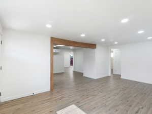 Unfurnished living room featuring hardwood / wood-style floors