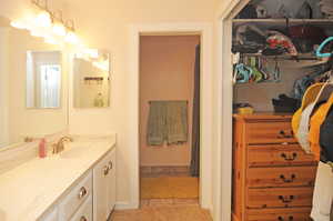 Bathroom with vanity and tile patterned flooring