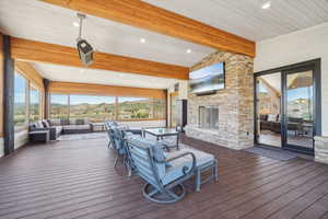 Wooden deck featuring an outdoor living space