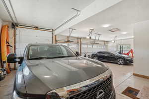 Garage featuring a garage door opener