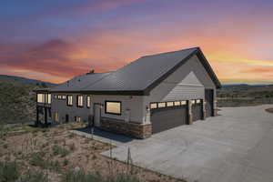 View of front facade featuring a garage