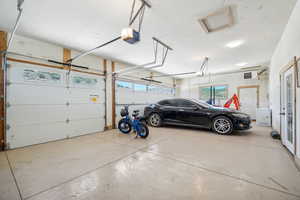 Garage featuring a garage door opener