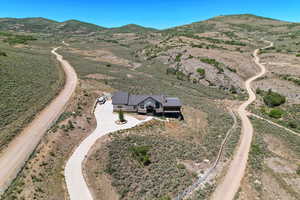 Birds eye view of property with a mountain view