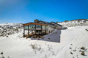 View of snow covered property