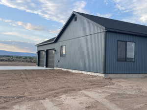 View of property exterior with a garage