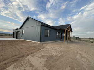 View of property exterior with a garage