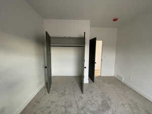 Unfurnished bedroom featuring carpet floors