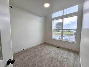 View of carpeted spare room