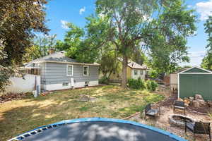 View of yard with a storage shed