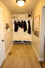 Mudroom with tile patterned floors