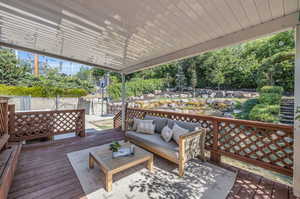 Wooden terrace featuring an outdoor hangout area