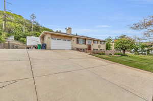 View of front of home featuring a garage and a front yard