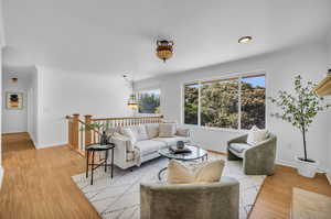 Living room with light wood-type flooring