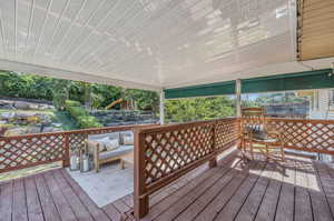 Wooden terrace with an outdoor hangout area