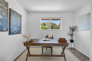 View of carpeted home office