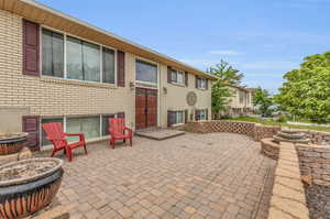 View of patio with a fire pit