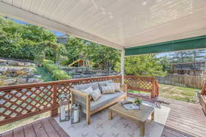 Wooden deck with an outdoor living space