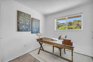 Office area featuring carpet flooring