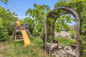 View of yard featuring a playground