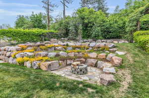 View of yard featuring an outdoor fire pit