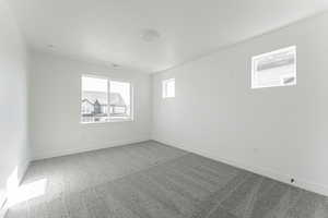 Spare room with carpet floors and a textured ceiling