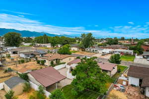 Birds eye view of property with a mountain view