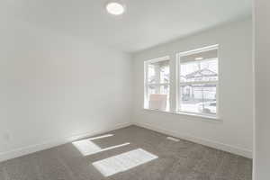 Unfurnished room with carpet floors