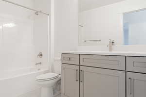 Full bathroom with vanity, toilet, and bathing tub / shower combination