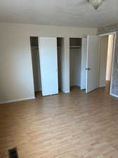 Features pergo flooring, and two closets