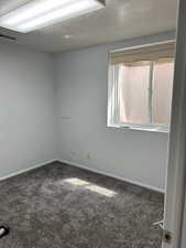 Features closet and carpeted floor.