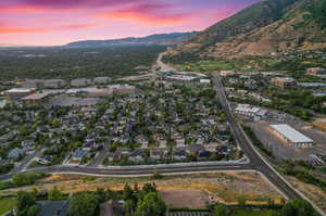 Aerial view at dusk featuring a mountain view