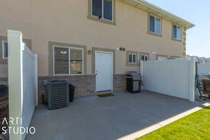 View of patio with central AC and grilling area