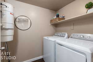 Laundry room featuring washer and clothes dryer