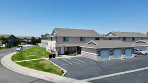 Townhome / multi-family property featuring a garage