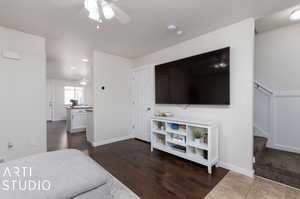 Interior space with dark wood-type flooring and ceiling fan