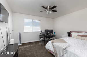 Bedroom featuring carpet and ceiling fan