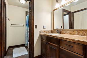 Bathroom featuring vanity and tile patterned flooring