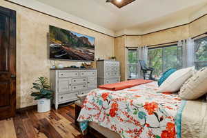 Bedroom with wood-type flooring and ceiling fan