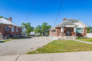 View of front of property with a front lawn