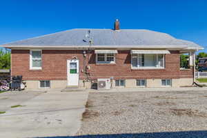 Back of house with a patio area