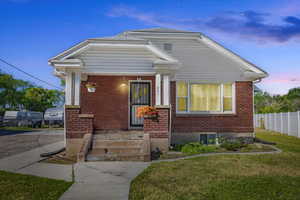 View of front of house with a lawn