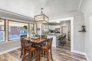 Dining space featuring an inviting chandelier, sink