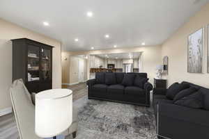 Living room with wood-type flooring