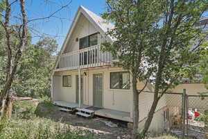 View of front of home with a balcony