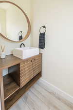 Bathroom featuring vanity and hardwood / wood-style floors