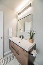 Bathroom featuring vanity and a textured ceiling