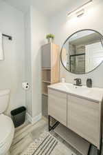 Bathroom featuring vanity and toilet