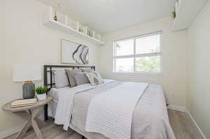 Bedroom featuring hardwood / wood-style flooring